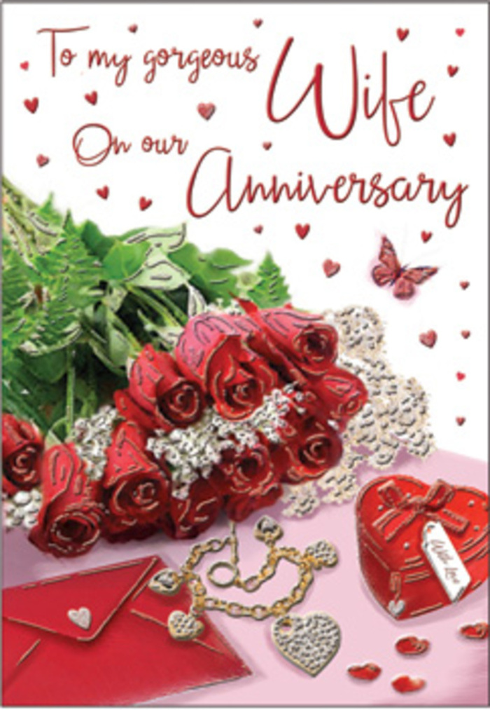 A richly romantic anniversary vignette is styled as though it sits on a beloved sideboard in a Belvedere home, composed with the same eye for detail a florist brings to a bespoke bouquet. At its centre, a small gathering of classic red roses rises in full, velvety blooms, each petal layered like a memory carefully kept. The roses are cradled by soft greenery and fine foliage, their cool tones framing the warmth of the crimson petals and giving the arrangement a freshly picked feel, as if it has just arrived from a nearby shop off Nuxley Road. Close by, an anniversary card and its matching envelope rest slightly askew, their creamy paper catching the light and their handwritten message only partly revealed, hinting at private vows and shared laughter. A piece of jewellery-subtle yet luminous-lies near the card, perhaps a pendant or ring chosen for this milestone year, its metal glinting softly like a secret between two people. Just beyond, a glossy heart-shaped box in deep red stands as a keepsake, evoking little treasures such as ticket stubs, love notes, or a lock of hair saved over time. Scattered hearts and tiny sparkling accents curve gently around the main pieces, guiding the eye in a loose arc that feels both intentional and effortless. A delicate butterfly motif appears within the composition, a quiet reminder of new beginnings and the way love evolves, much like the changing seasons around Belvedere's green spaces. The light is diffused and calm, casting faint reflections and mild shadows that give the arrangement depth. Every detail works together to convey an anniversary moment that is intimate, tender, and deeply personal.